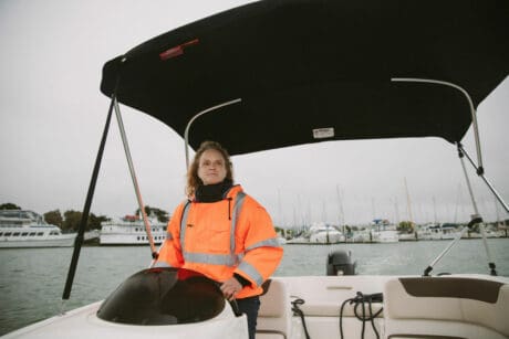 Women driving boat after securing Small Business Loans