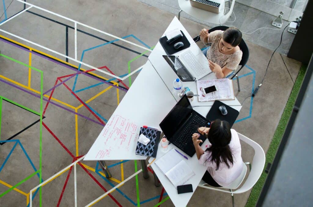 Two business owners discussing how to set up a small business network