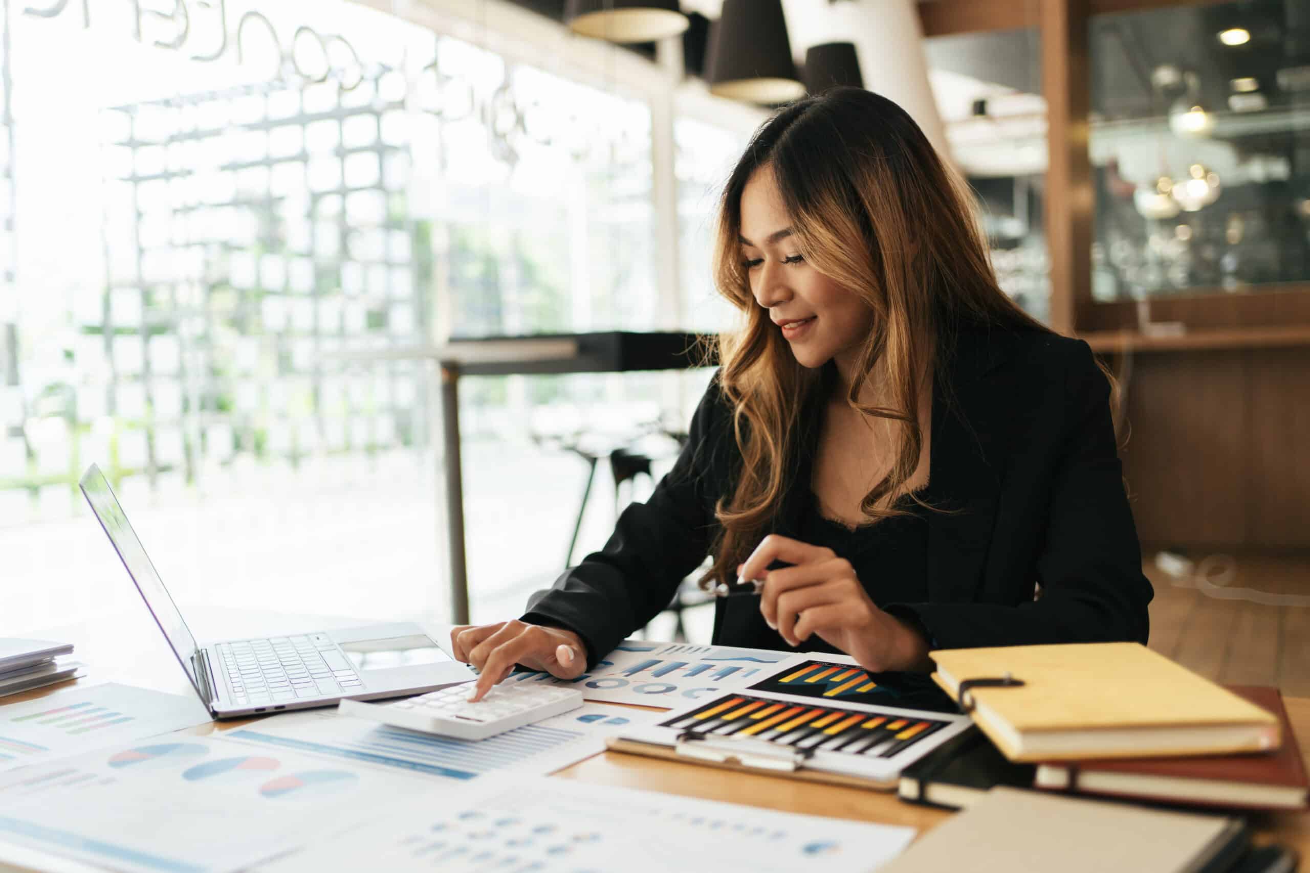 Business women working with calculator