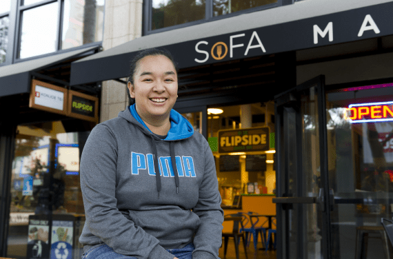 Cynthia Vo in front of their restaurant