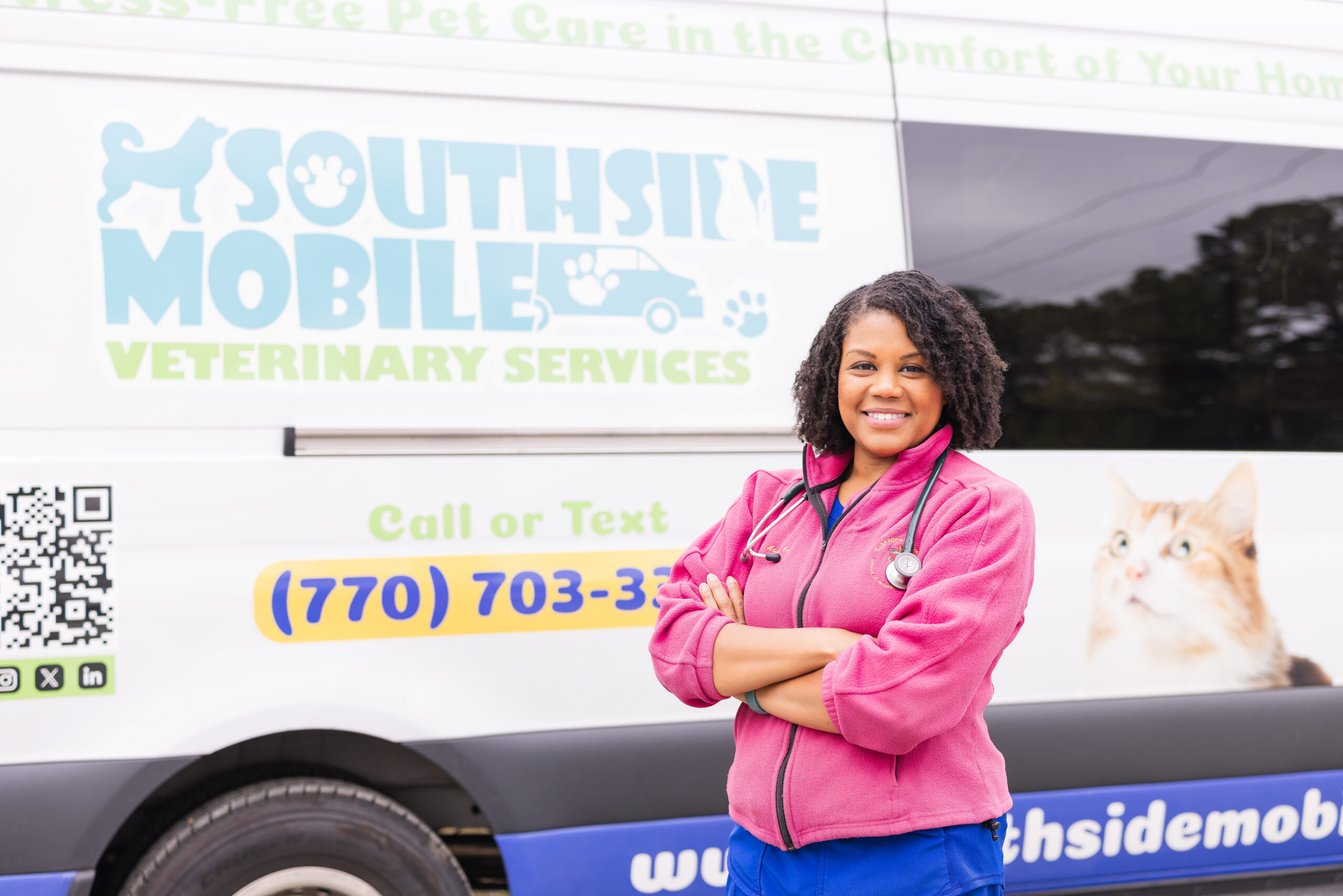 Dr. Mary Aboko-Cole, Owner, Veterinarian posing in front of her Southside Mobile Vet