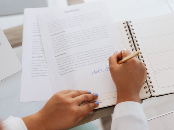 Procurement readiness for small business owner who is signing a contract