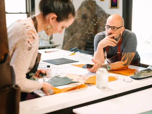 Two small business owners discussing designs
